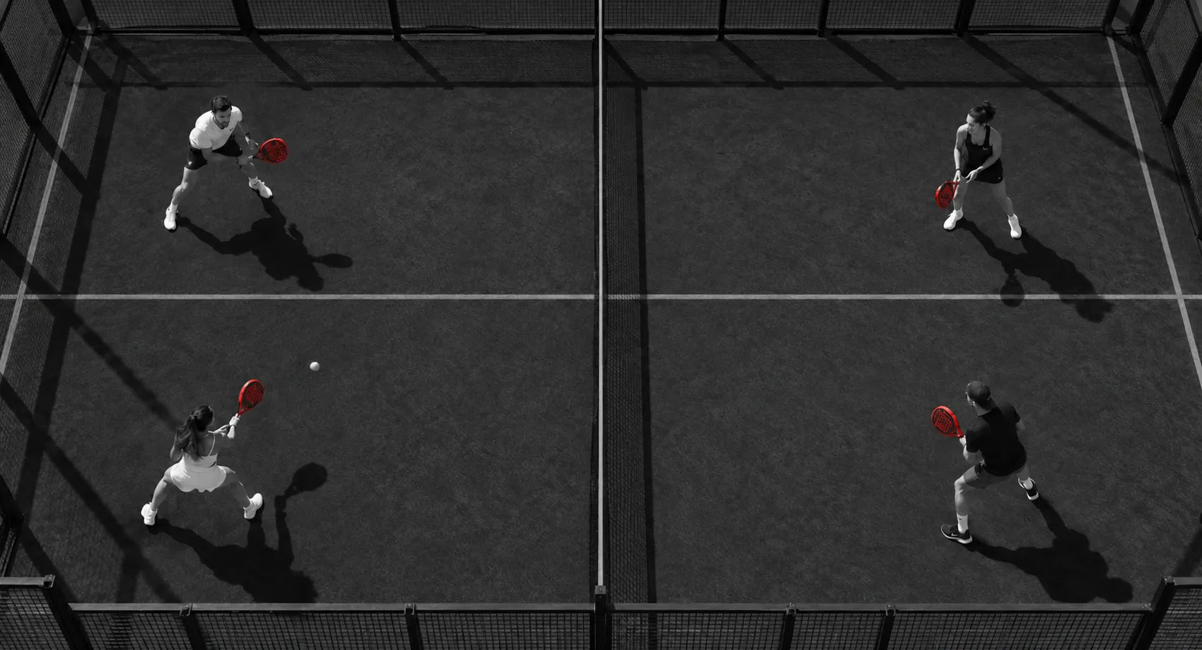 Four friends playing padel, seen from above